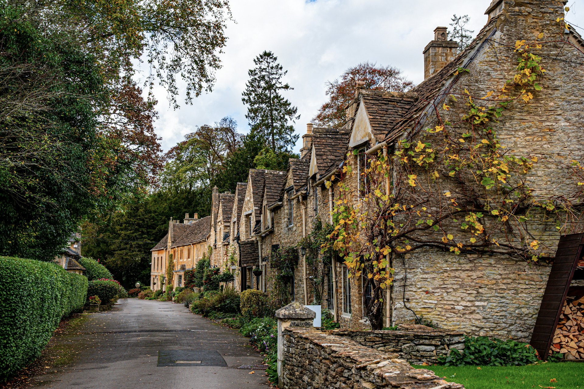 A lane of stone cottages in Castle Combe in the Cotswolds